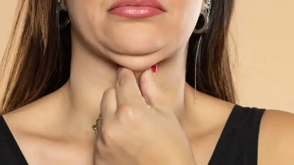 An image of a woman with double chin, sad, worried : Non Surgical Double Chin Removal Treatment in Robroyston, UK